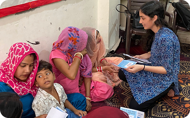Trishha interacting one-on-one with mothers and children