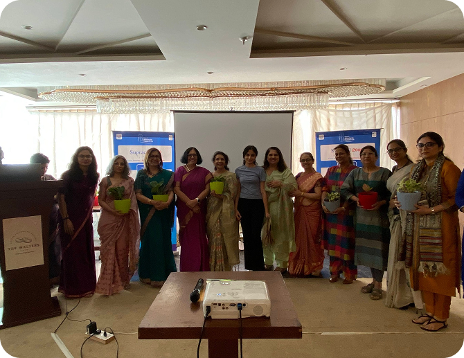 Group of doctors, specialists and Trishha on stage